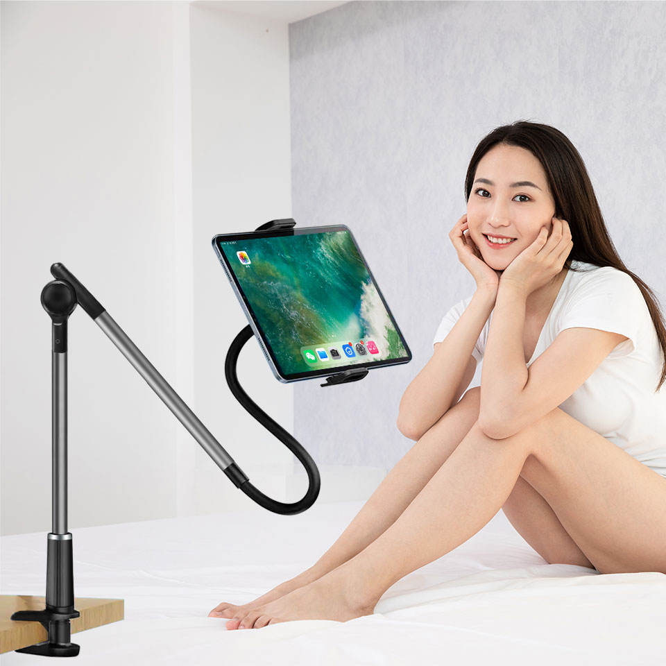 Gooseneck tablet holder clamped to a bedside table
