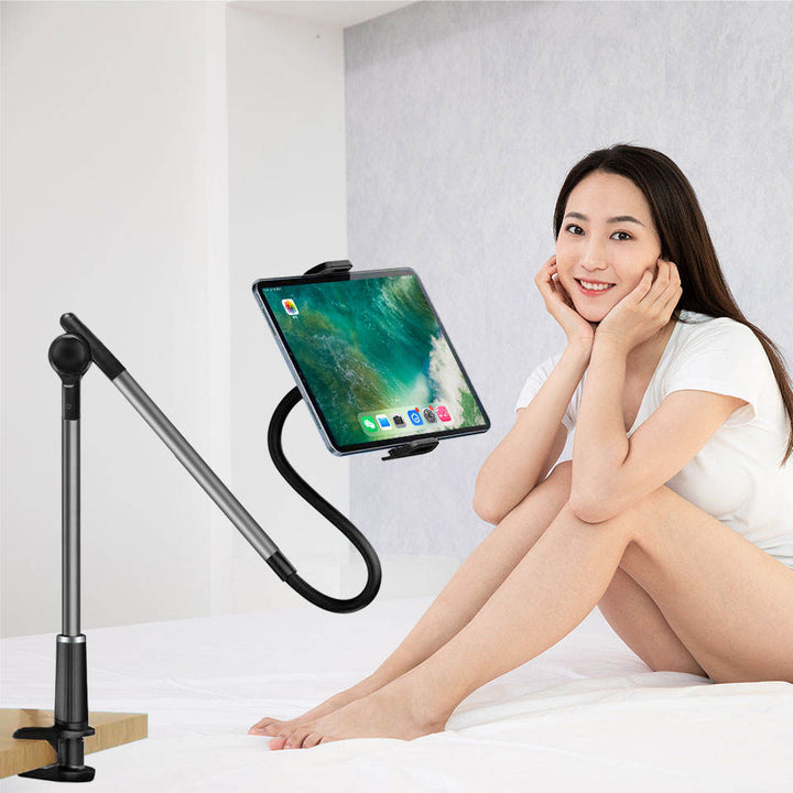 Gooseneck tablet holder clamped to a bedside table