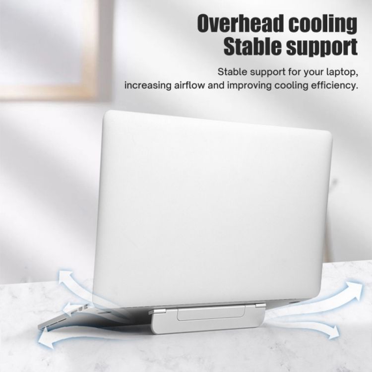 Laptop raised on a folding riser for airflow underneath