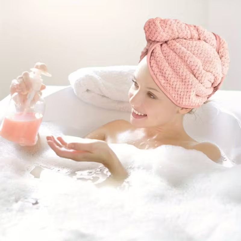 Woman wearing a pink jacquard woven hair turban